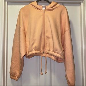 H&M drawstring sweatshirt. Orange. size Med